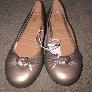 Woman’s rose gold flats